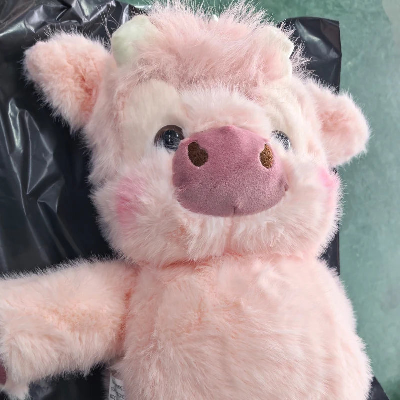 A pink West Highland Calf plush toy with soft fur and a pink nose.