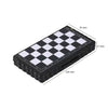 A black portable folding magnetic chess set with a checkered board and dimensions marked.