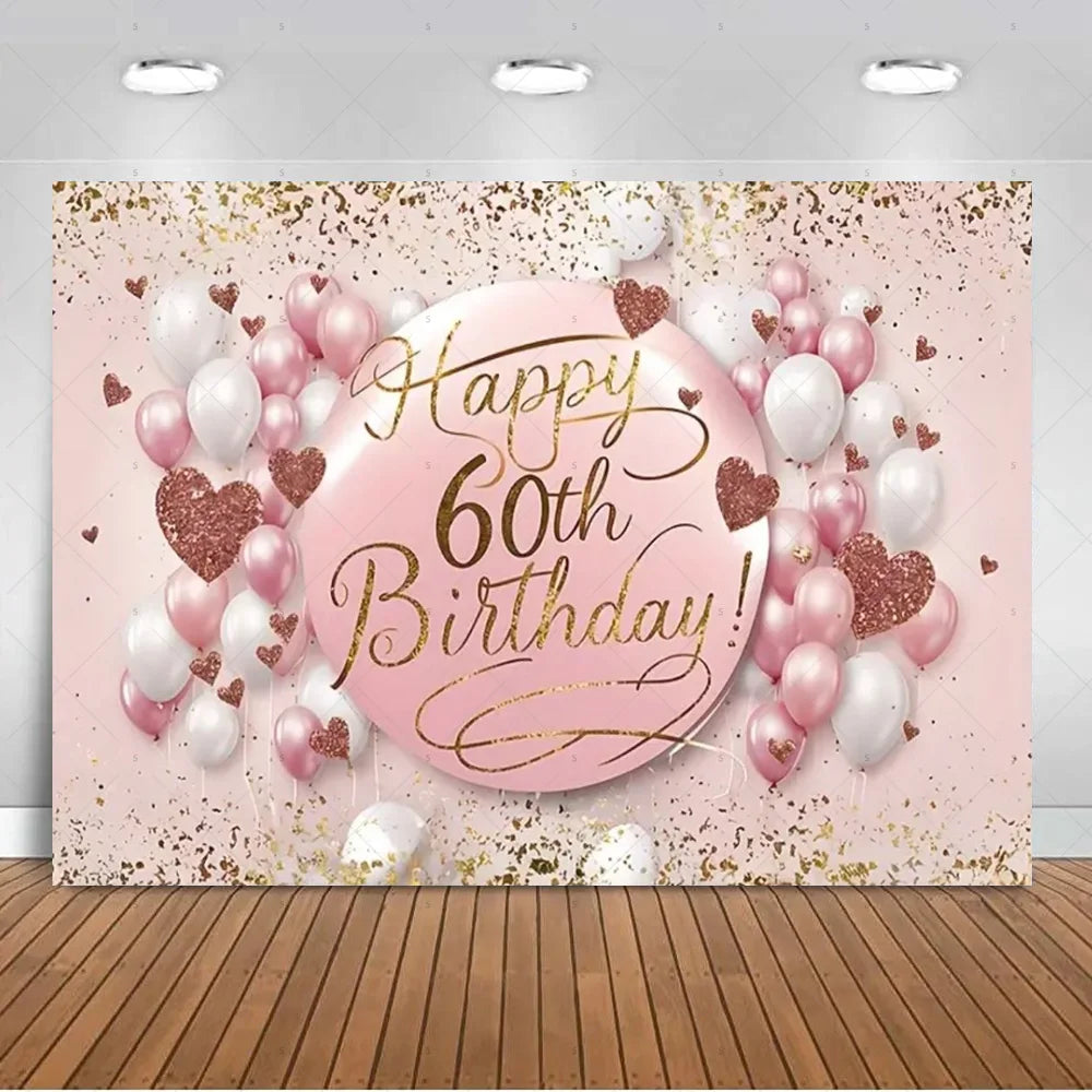 A pink and gold balloon backdrop featuring hearts and balloons for a 60th birthday photo booth.