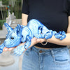 A hand holds a realistic blue Sphynx cat fidget toy with wrinkled skin and detailed features.