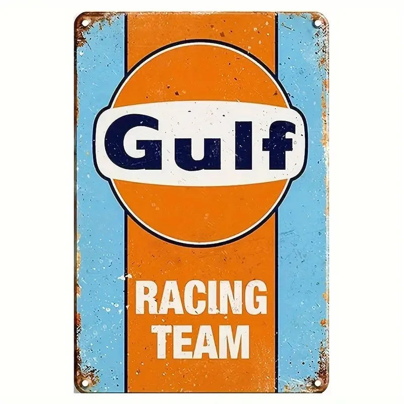 Vintage metal tin sign with an orange and blue background featuring the word Gulf Racing Team
