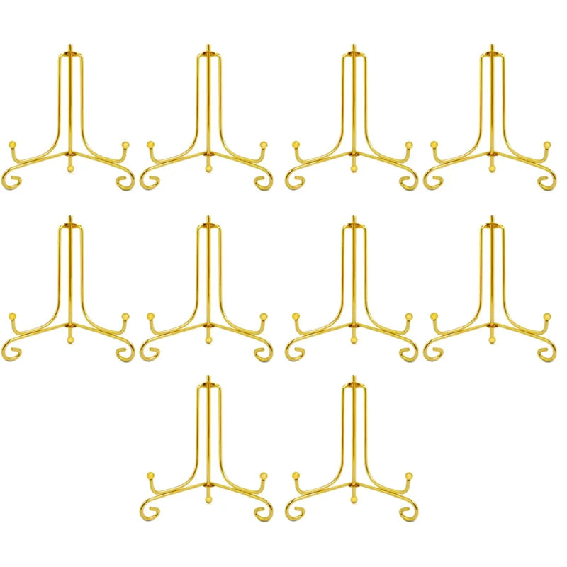 A set of eight gold-colored metal display easels designed for holding photos, plates, and collectibles.