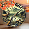 Vintage hunting scene metal wall sign featuring deer and a rifle against a mountain backdrop with autumn leaves.