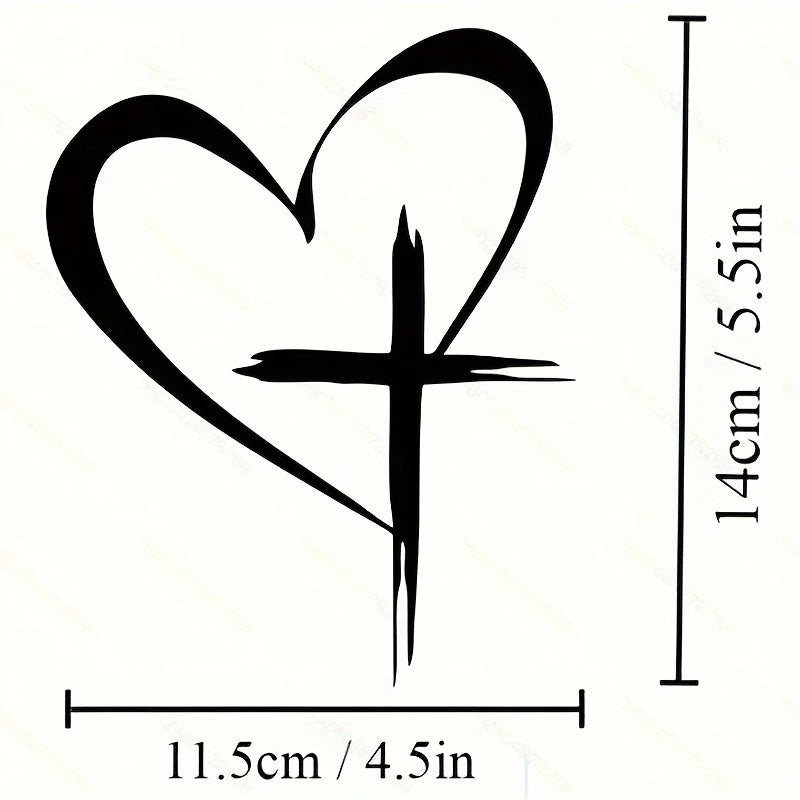 Black vinyl decal of a heart shape with a cross inside, measuring 14cm high and 11.5cm wide.
