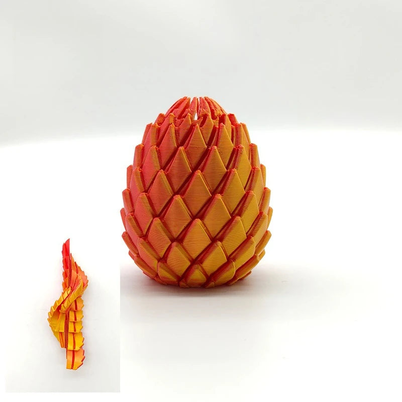 A close-up view of a 3D printed dragon egg fidget toy with textured orange and yellow scales.