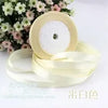 Roll of cream or ivory silk satin ribbon used for wrapping