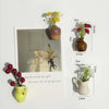 A collection of mini ceramic vases with artificial flowers shown next to a card displaying dimensions.