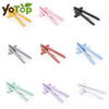 A collection of reusable wheat straw finger chopsticks in various colors and styles.