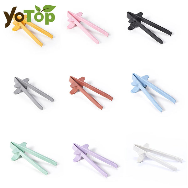 A collection of reusable wheat straw finger chopsticks in various colors and styles.