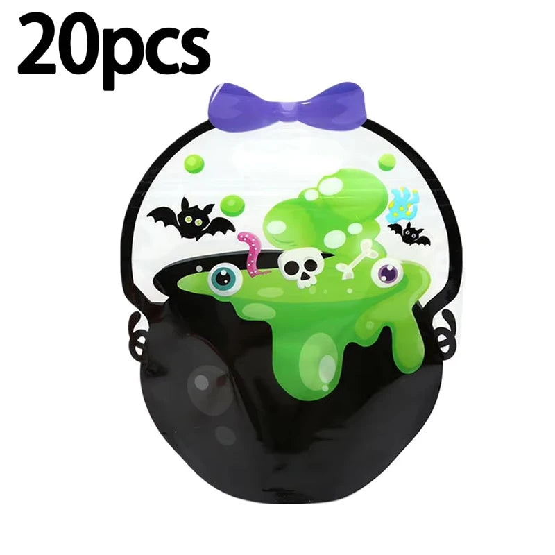 A clear Halloween pumpkin witch treat bag with a purple bow and green slime design.