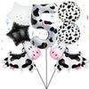A set of black and white cow print letter balloons forming the letter S and several polka-dotted balloons.