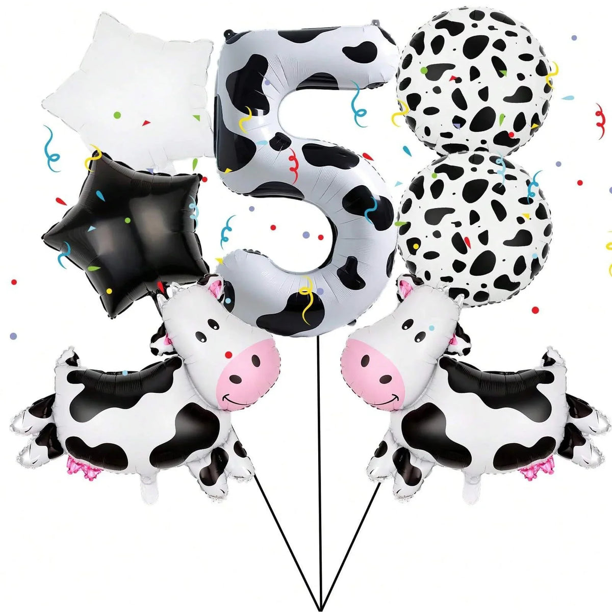 A set of black and white cow print letter balloons forming the letter S and several polka-dotted balloons.