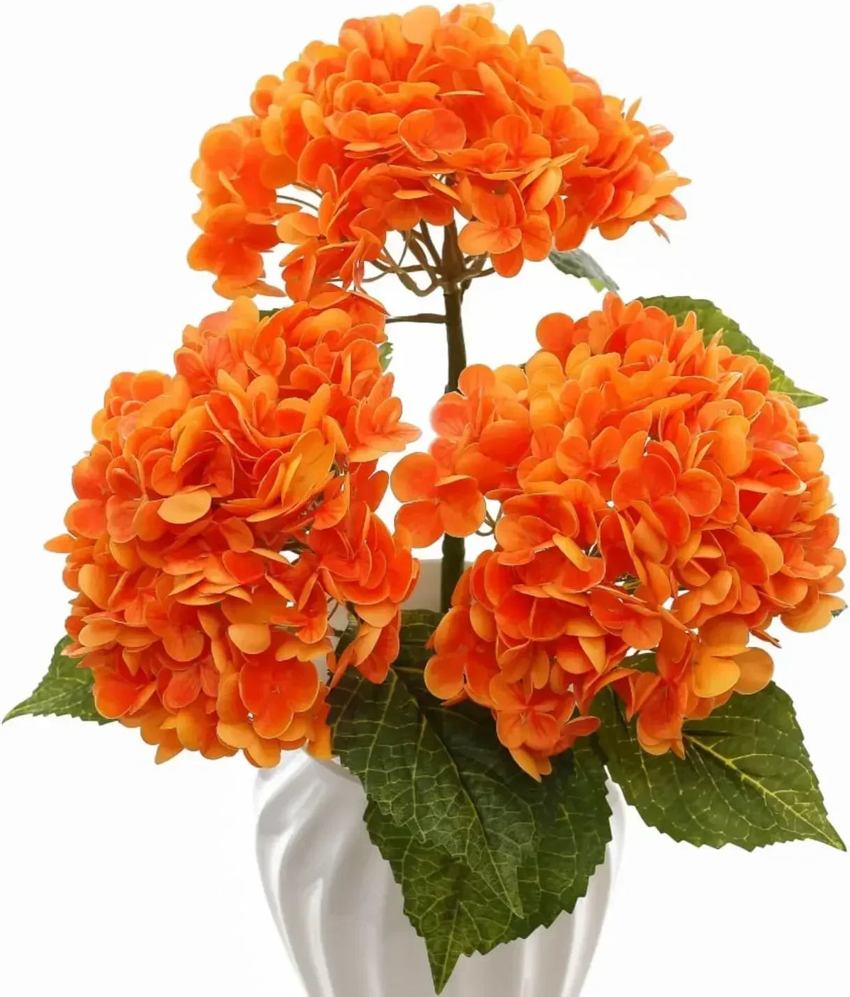 A cluster of bright orange artificial hydrangea flowers on green leaves.