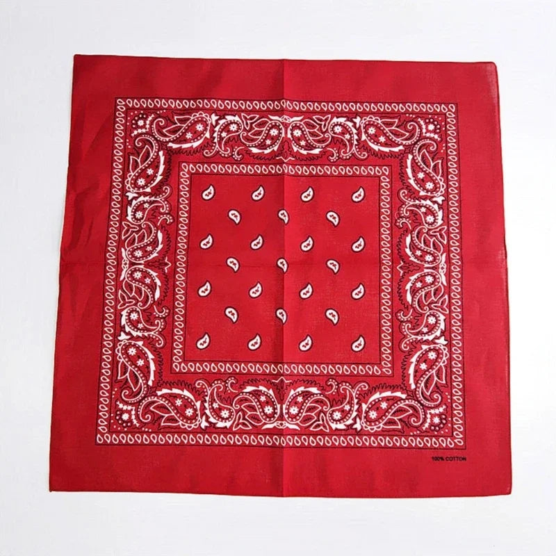 A red fabric featuring white embroidery in a geometric pattern, likely part of a classic cowboy costume set.