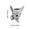 Un pot de résine gris en forme de tête de bouledogue français.