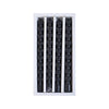 A set of four black taper candles designed to simulate dripping blood effects.