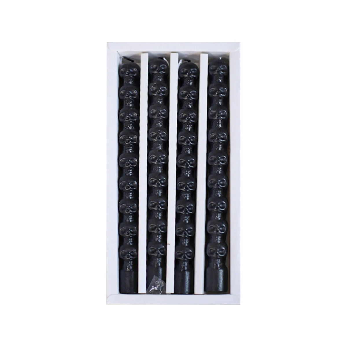 A set of four black taper candles designed to simulate dripping blood effects.