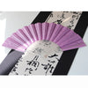 A purple glitter folding fan with transparent ribs is displayed against a black background and traditional Japanese writing.