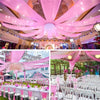 Pink sheer chiffon curtains draped across a venue for a wedding or event backdrop