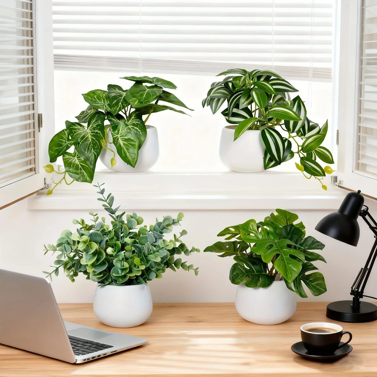 A window sill display featuring various artificial bonsai succulent plants in white pots on a wooden desk.