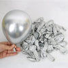 Silver foil balloons and number foils are displayed next to a silver balloon.