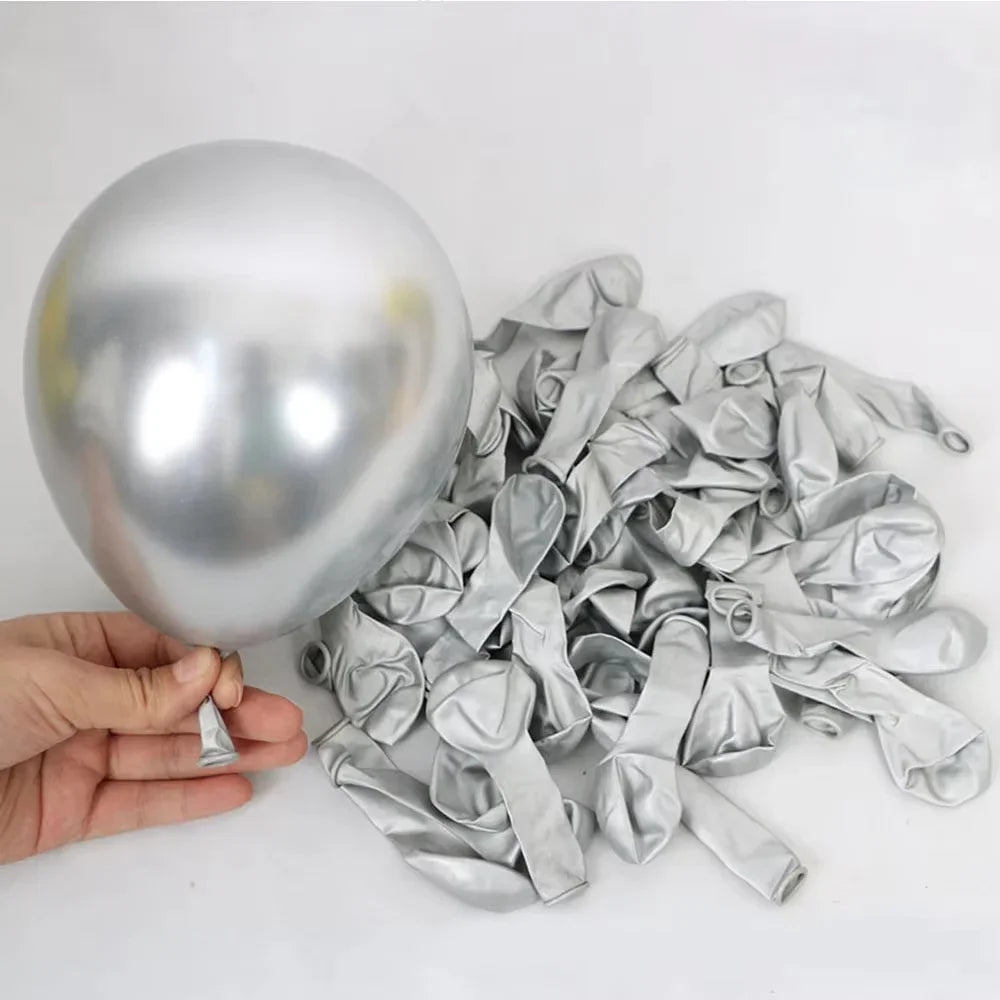 Silver foil balloons and number foils are displayed next to a silver balloon.