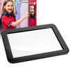 A girl is holding a compact magnetic locker mirror with a strong hold in front of a red cabinet.