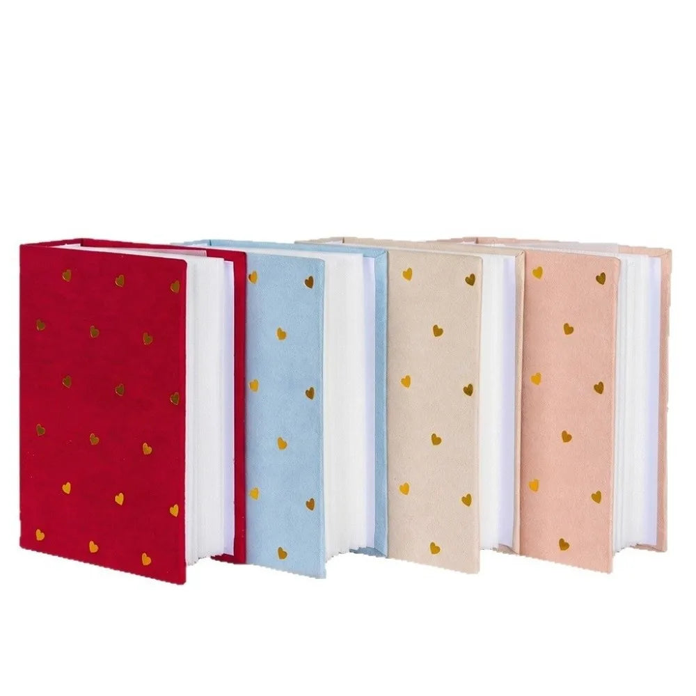 A set of five laminated photo albums in red, blue, beige, and pink covers.