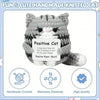 A handmade crochet gray and white striped cat plush toy with a smiling expression.