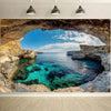 A scenic view of a blue sea cave with clear turquoise water and rocky cliffs under a bright sky.