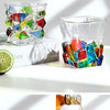 A collection of colorful faceted crystal whiskey glasses showcasing various geometric patterns and vibrant colors.