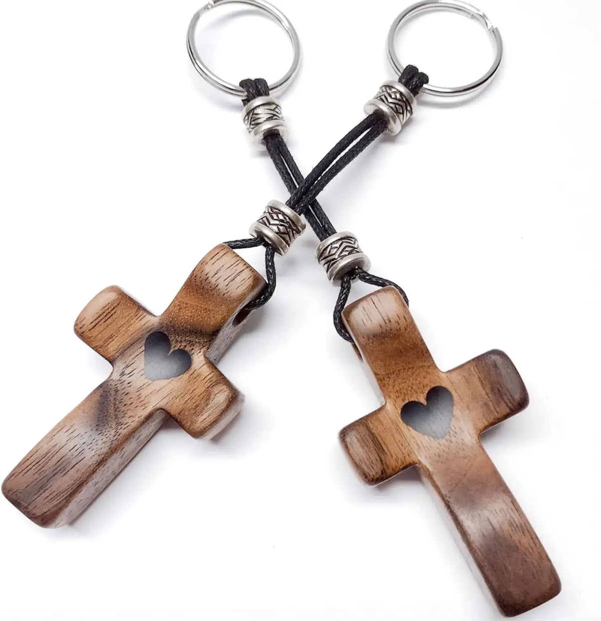 A wooden comfort prayer cross with silver rings and black cord for anxiety relief.