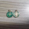 A pair of silver-toned religious pendants featuring a cross design and a depiction of Jesus Christ.