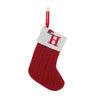 A red knitted sock with a white cuff featuring a red letter H and a hanging loop for tree decoration.