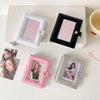 A collection of pink and silver photo card holders in various frames and holders arranged on a white surface.