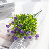 Artificial eucalyptus branch with seven green stems used for home decor or wedding arrangements.