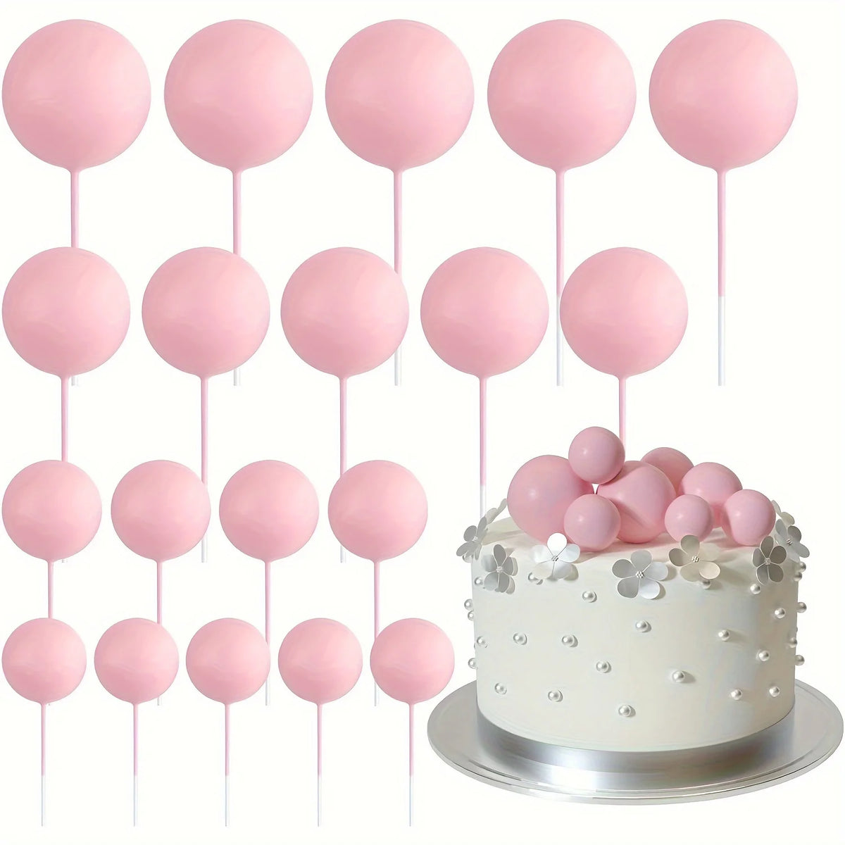 A white cake decorated with pink mini foam ball toppers on sticks.