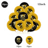 A collection of black and gold graduation balloons featuring cap and star designs.