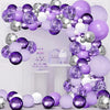 A large arrangement of purple and silver latex balloons forming an arch and clusters on a white background.