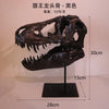 A black resin sculpture of a Tyrannosaurus skull displayed on a stand.