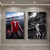 A framed canvas wall art featuring a dramatic photo of Cristiano Ronaldo in a red jersey during a football match.