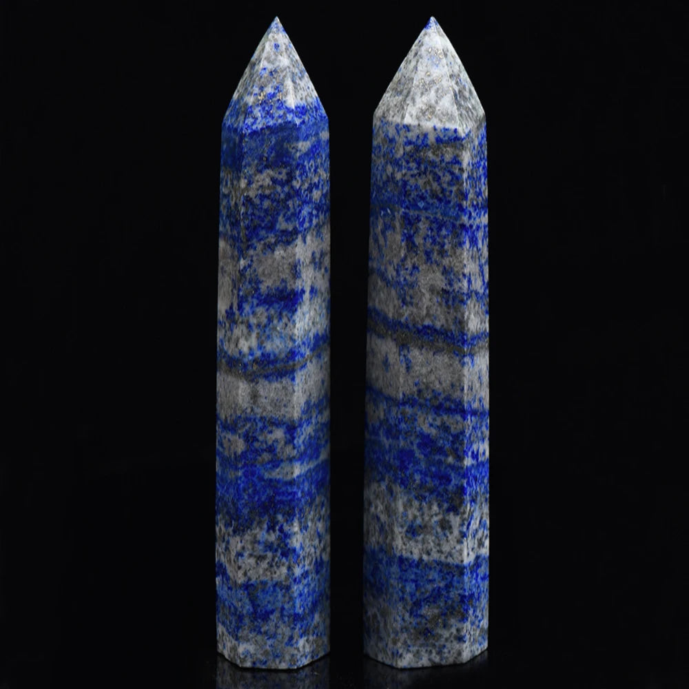 Two tall, pointed crystal towers made of blue and gray lapis lazuli for meditation and decor.