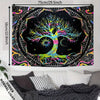 A black tapestry featuring a vibrant tree of life with colorful branches and roots against a cosmic galaxy background.