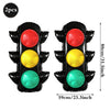 A set of two black race car traffic light balloons with red, yellow, and green lights.