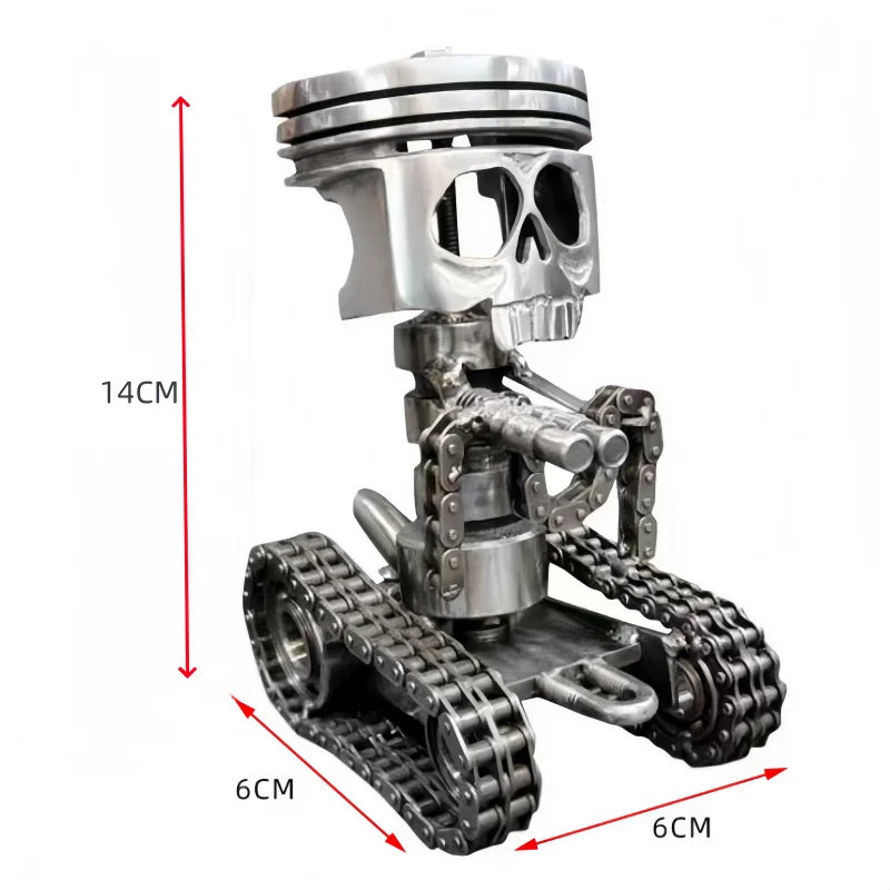 A silver mechanical piston skull sculpture with metal gears and a textured base.
