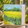 A 6-inch laminated photo album featuring a painting of a sunny yellow field with green trees and blue flowers.