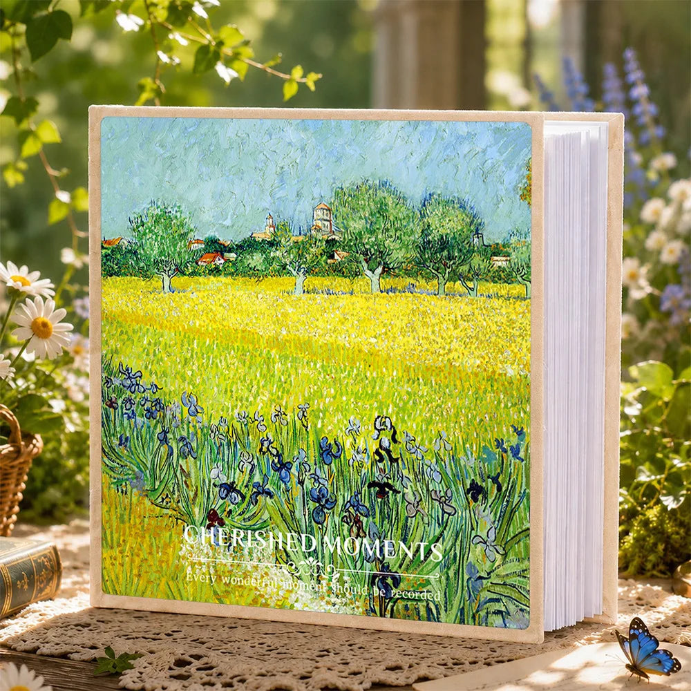 A 6-inch laminated photo album featuring a painting of a sunny yellow field with green trees and blue flowers.