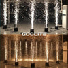 A display of golden sparks shooting into the air from multiple nozzles in a dark venue.
