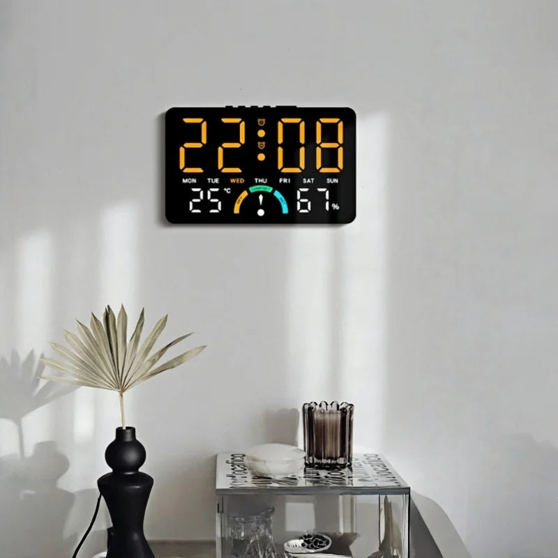 A digital alarm clock displaying 22:08, temperature, and humidity on a white wall.