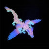 A translucent, light blue and purple 3D printed magic dragon ornament with intricate scales against a black background.